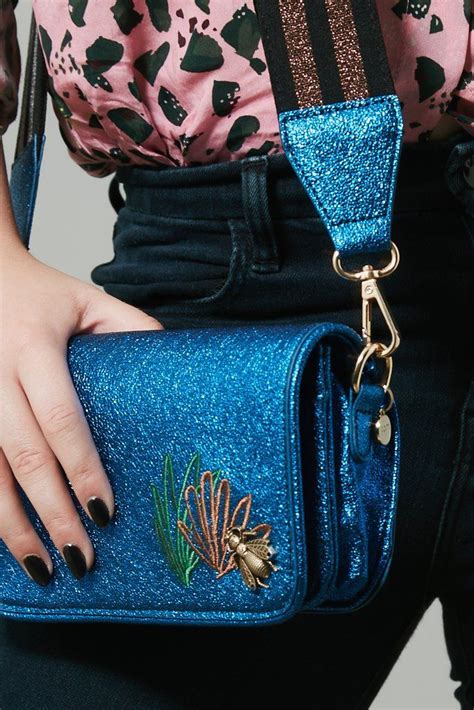Elevate Your Style with Glittering Spell Handbags: The Ultimate Fashion Accessory